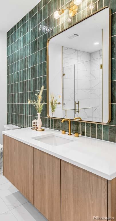 3520 Chestnut Place, Unit PH1201 Denver, CO 80216 - Photo 28 of 44 a view of a bathroom with a tub