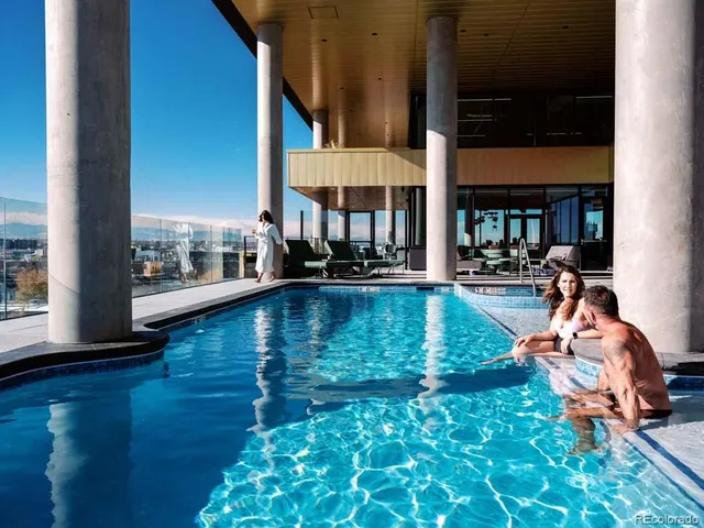 a view of a city from a dining room with furniture