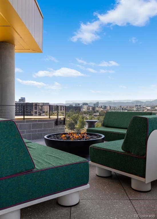 3520 Chestnut Place, Unit PH1201 Denver, CO 80216 - Photo 34 of 44 a view of a chairs in a yard