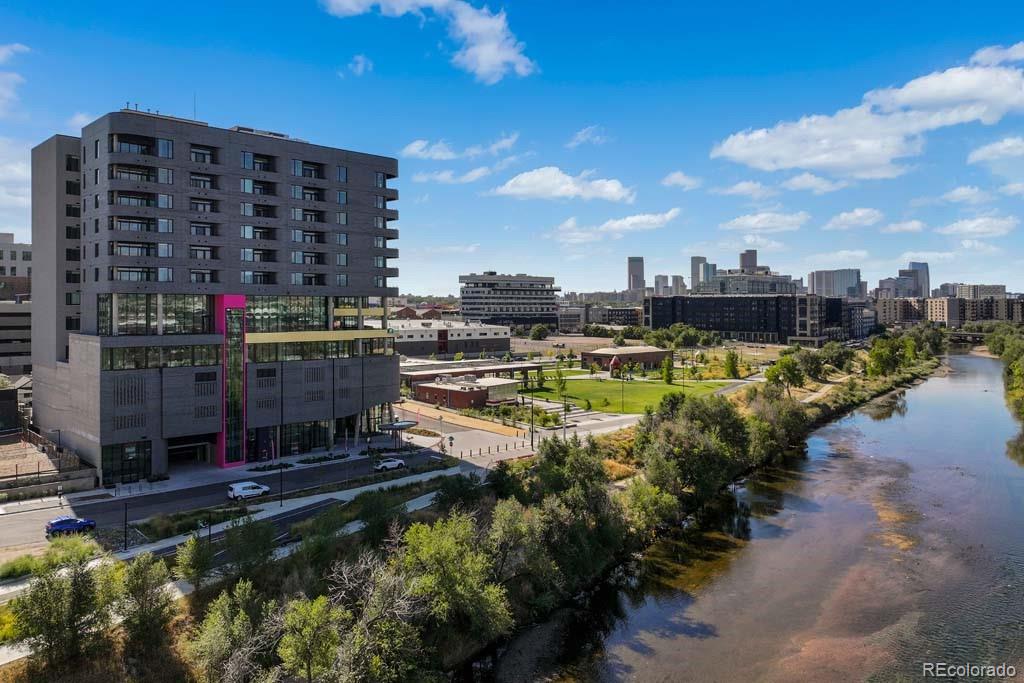 3520 Chestnut Place, Unit PH1201 Denver, CO 80216 - Photo 42 of 44 a view of a lake with building in front of it