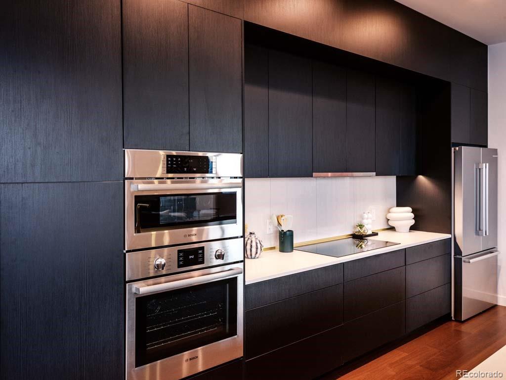 3520 Chestnut Place, Unit PH1201 Denver, CO 80216 - Photo 8 of 44 a kitchen with a sink appliances and cabinets