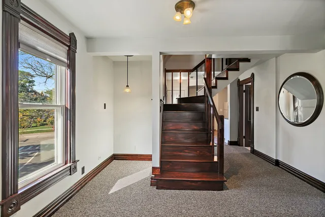 a view of entryway with wooden floor and window