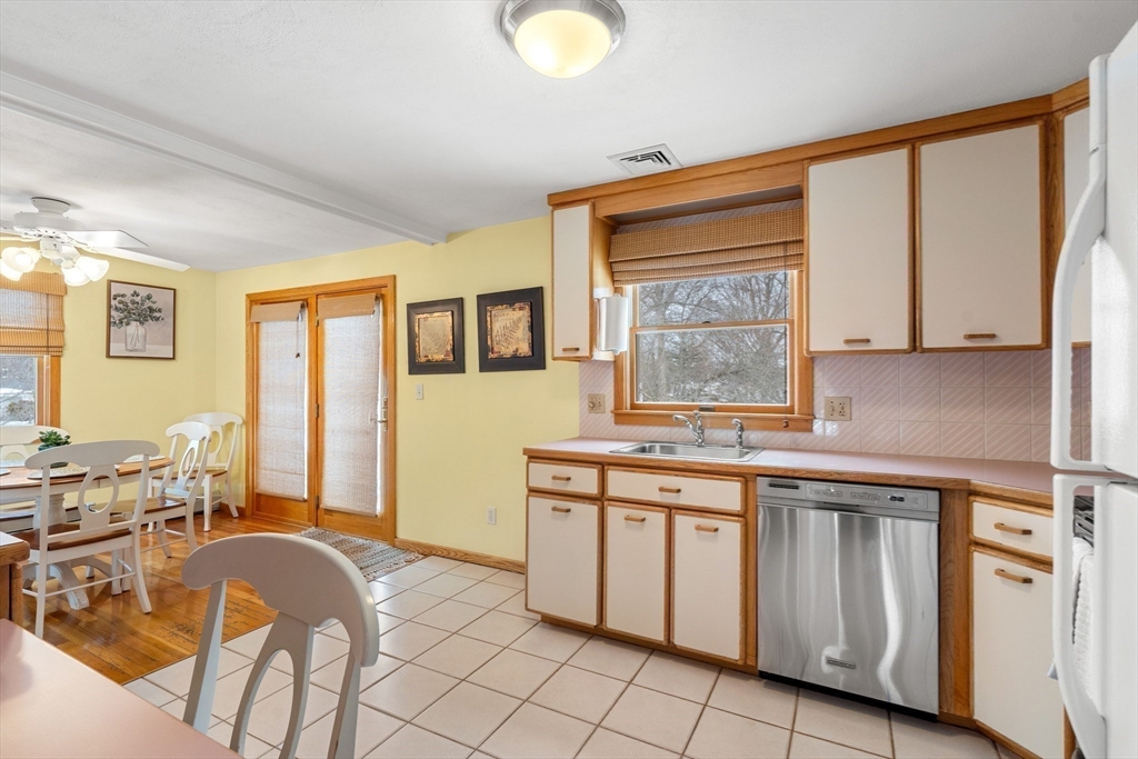 7 Belfast Road Peabody, MA 01960 - Photo 17 of 37 a kitchen with a stove a sink and a refrigerator