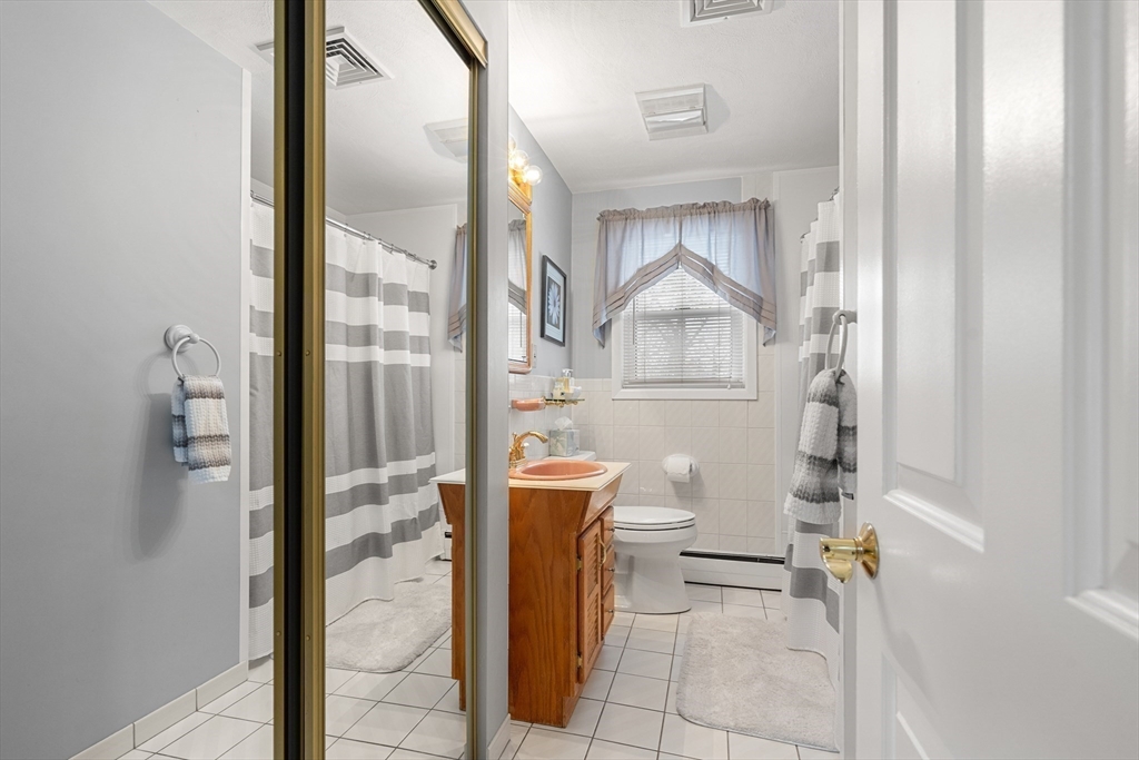 7 Belfast Road Peabody, MA 01960 - Photo 33 of 37 a bathroom with a bathtub and a shower