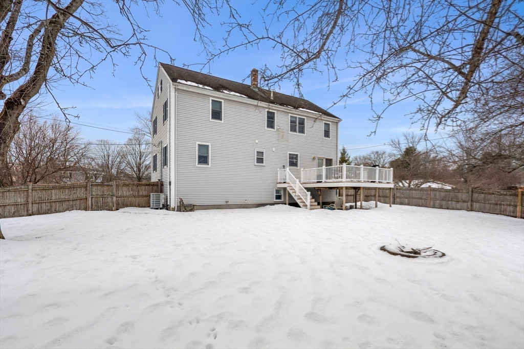 7 Belfast Road Peabody, MA 01960 - Photo 36 of 37 a view of house with a yard covered in snow