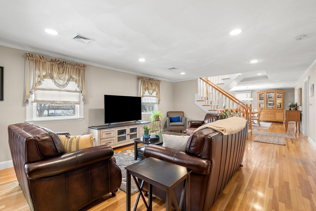 7 Belfast Road Peabody, MA 01960 - Photo 7 of 37 a living room with furniture and a flat screen tv