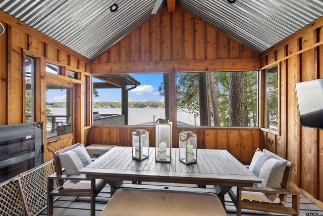 a bathroom with a sink a toilet a shower and a mirror