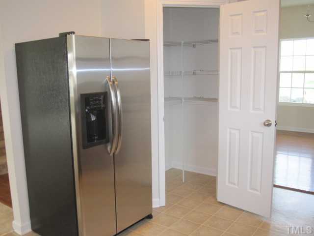 3222 Dove Tree Lane, Unit LOT81 Raleigh, NC 27610 - Photo 3 of 13 This home includes a Stainless Steel side by side refrigerator. Notice the large pantry.