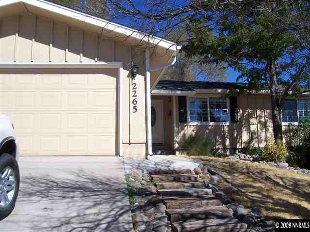 2265 West 7th Street Reno, NV 89503 - Photo 1 of 8 a front view of a house with a yard