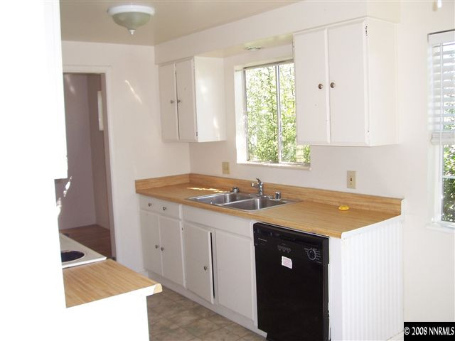 2265 West 7th Street Reno, NV 89503 - Photo 5 of 8 a kitchen with a sink and cabinets