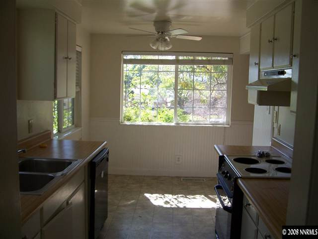2265 West 7th Street Reno, NV 89503 - Photo 6 of 8 a kitchen that has a sink and a stove