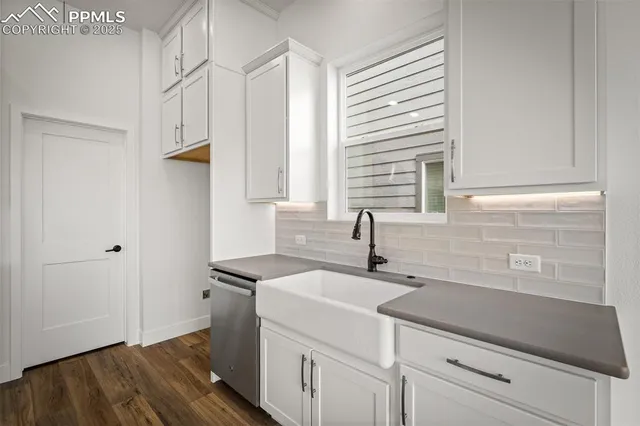a kitchen with a sink and cabinets