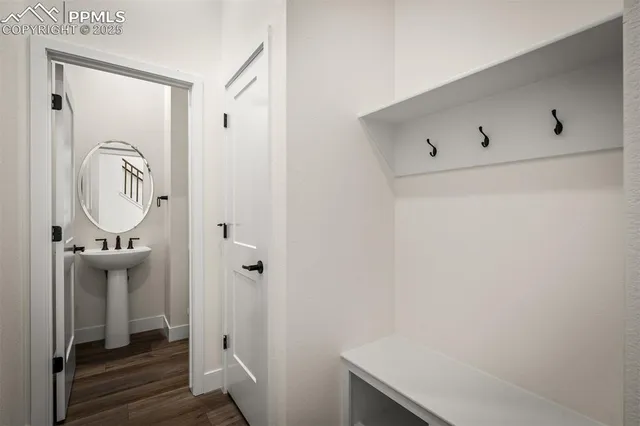 a bathroom with a granite countertop sink