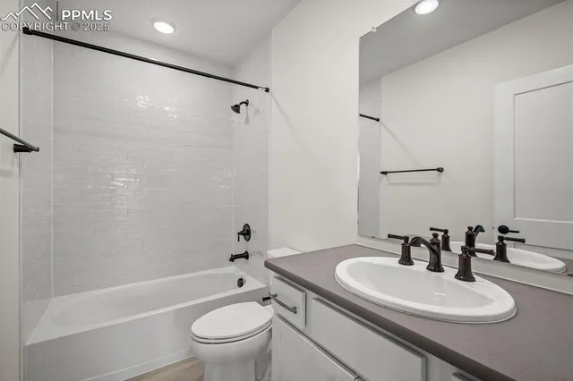 a view of a house with wooden fence