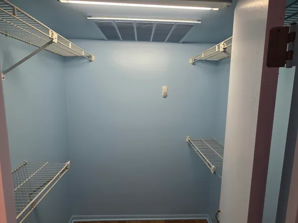 a view of a room with racks on the wall