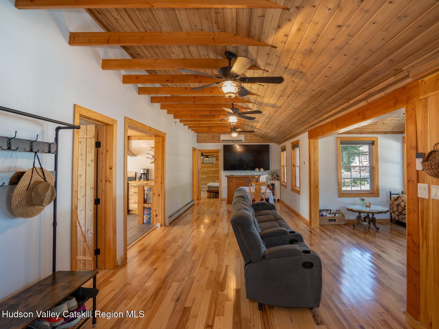 16 Robin Road, Unit GO UP ROBIN ROAD NOT DOWN Copake, NY 12521 - Photo 17 of 32 a view of a livingroom with furniture a ceiling fan and wooden floor