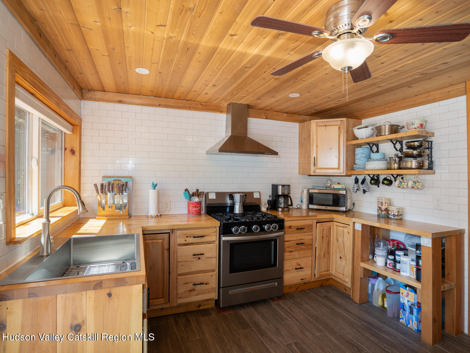 16 Robin Road, Unit GO UP ROBIN ROAD NOT DOWN Copake, NY 12521 - Photo 20 of 32 a kitchen that has a lot of cabinets in it and wooden floors
