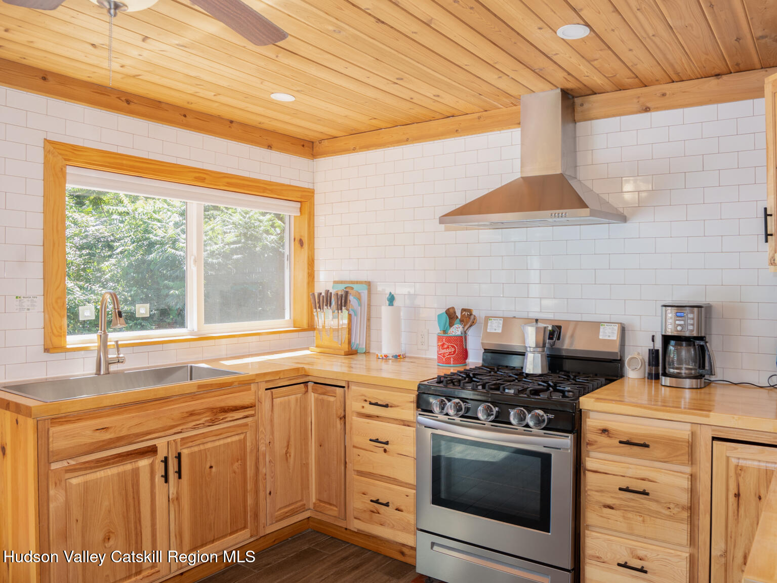 16 Robin Road, Unit GO UP ROBIN ROAD NOT DOWN Copake, NY 12521 - Photo 21 of 32 a kitchen with a stove and a sink