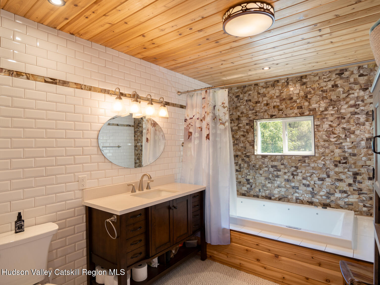 16 Robin Road, Unit GO UP ROBIN ROAD NOT DOWN Copake, NY 12521 - Photo 25 of 32 a bathroom with a sink and a mirror