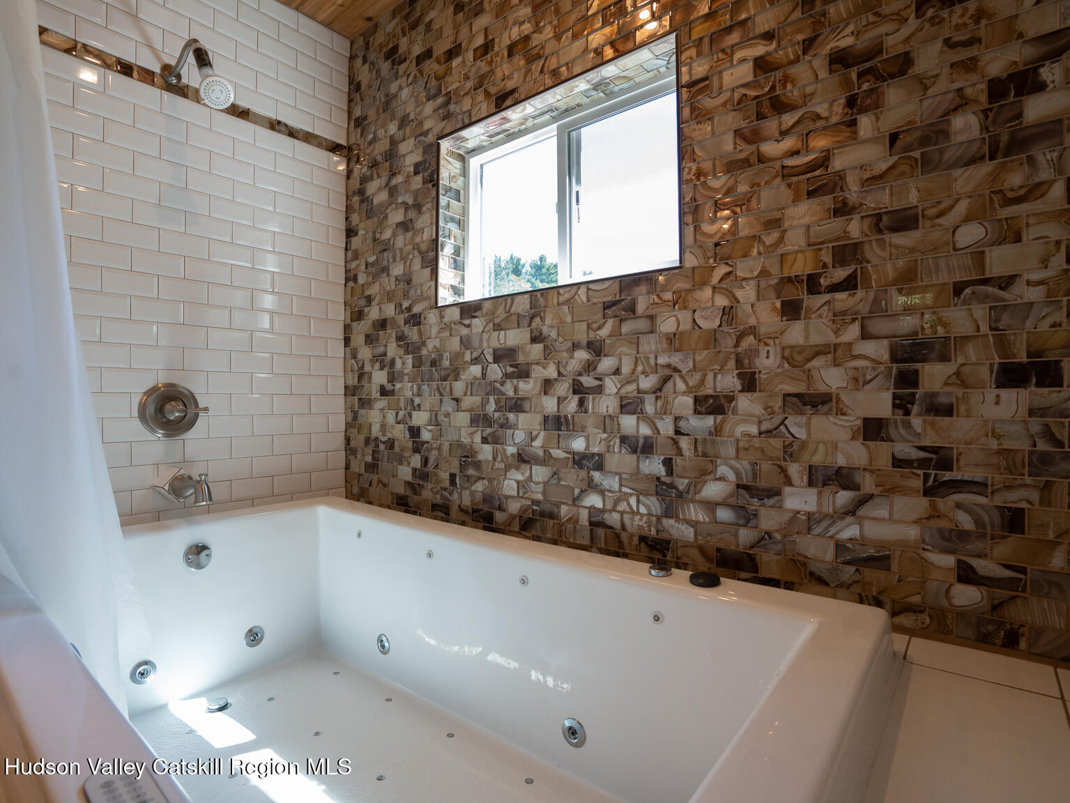 16 Robin Road, Unit GO UP ROBIN ROAD NOT DOWN Copake, NY 12521 - Photo 27 of 32 a bathroom with a bathtub and a shower