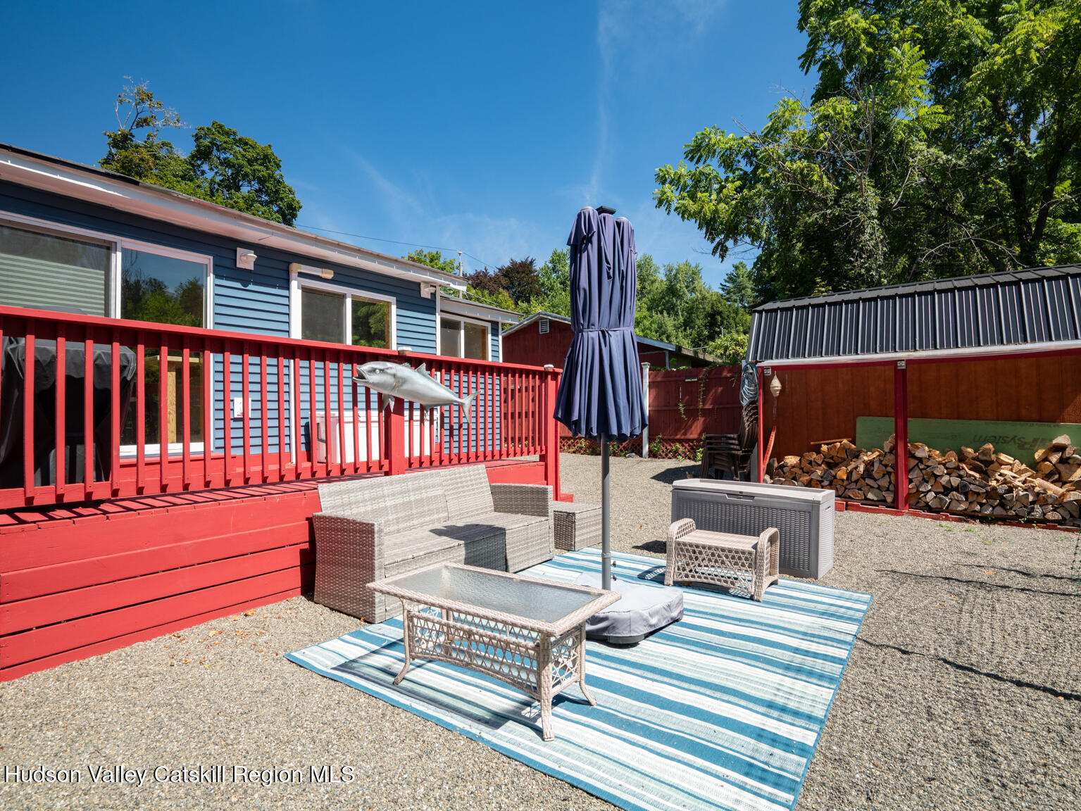 16 Robin Road, Unit GO UP ROBIN ROAD NOT DOWN Copake, NY 12521 - Photo 10 of 32 a view of a chairs and tables in the back yard of the house
