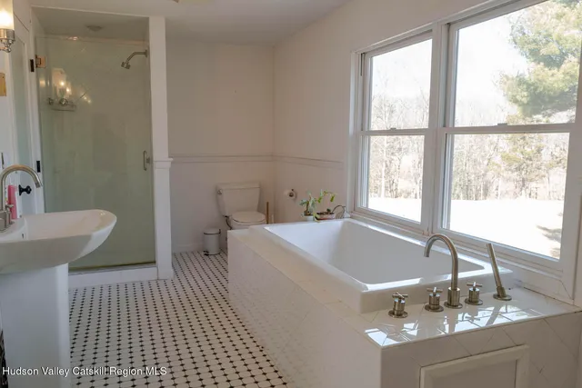 a bath room with a sink and a toilet