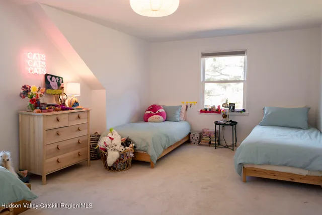 a bedroom with a bed and a chair