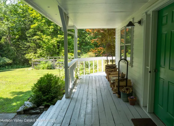 a view of balcony with wooden floor