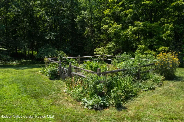 a backyard of a house with lots of green space