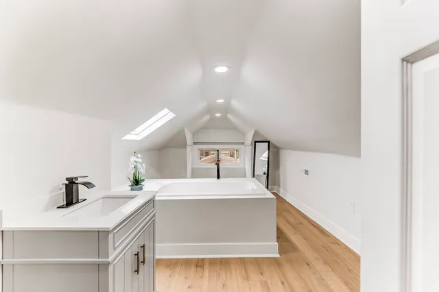 a kitchen with a sink and a refrigerator