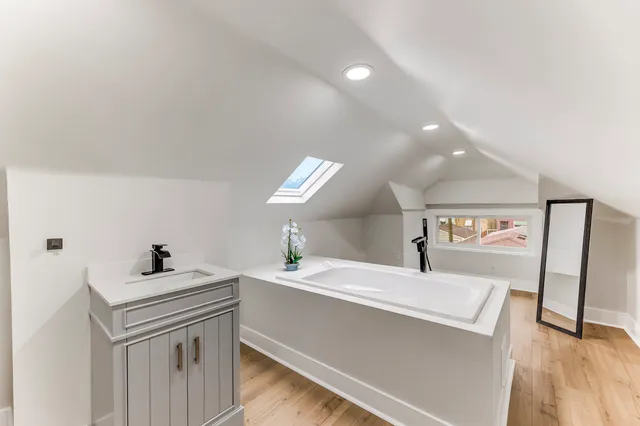 a bathroom with a sink a mirror and a