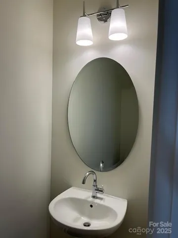 a close view of a sink and mirror in a bathroom