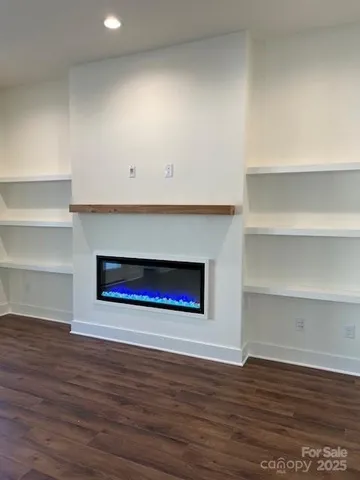 a room with a hardwood and a fireplace