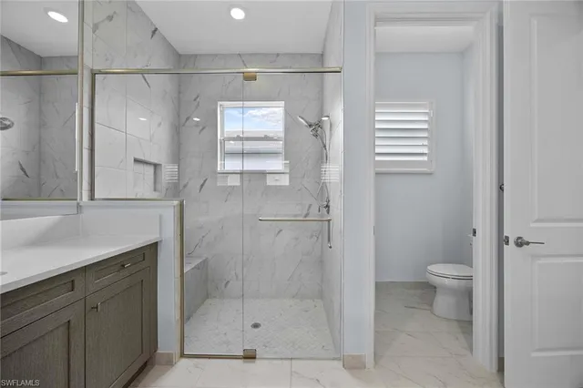 a bathroom with a shower and a toilet