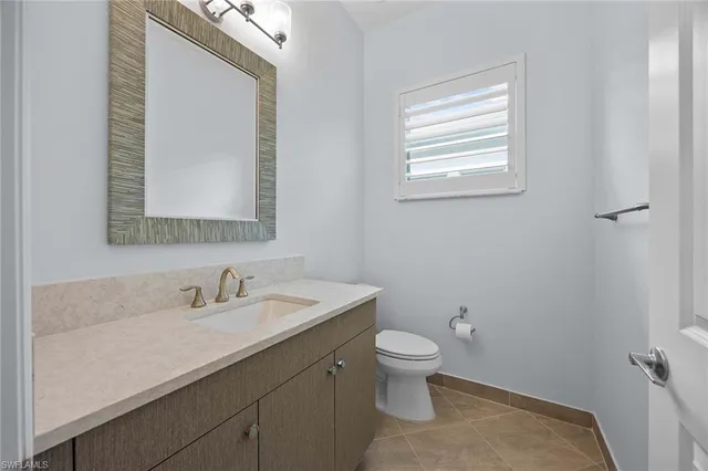 a utility room with cabinets washer and dryer