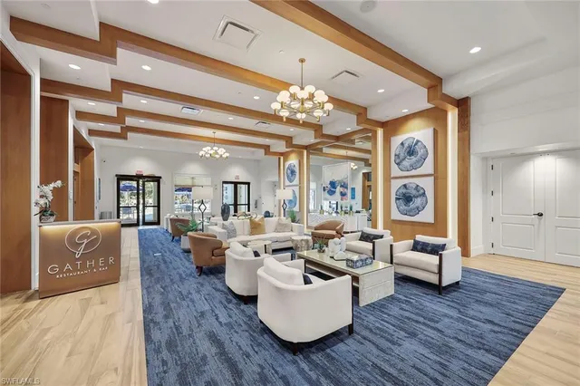 a lobby with a couch and a rug