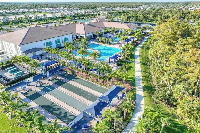 a view of a chairs and table in a backyard