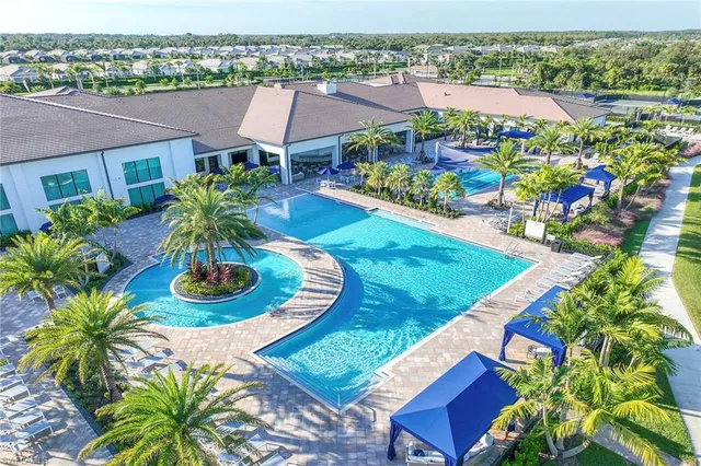 a view of house with garden space and lake view
