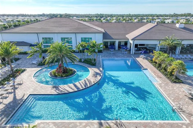 an aerial view of a house with swimming pool