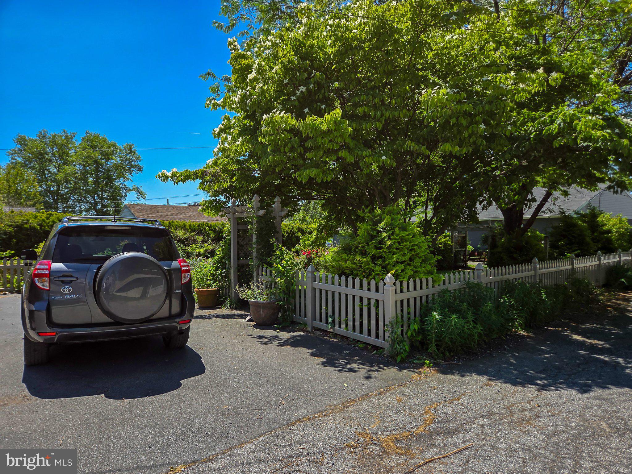 524 Locust Street Denver, PA 17517 - Photo 29 of 36 Charming home with lush greenery.