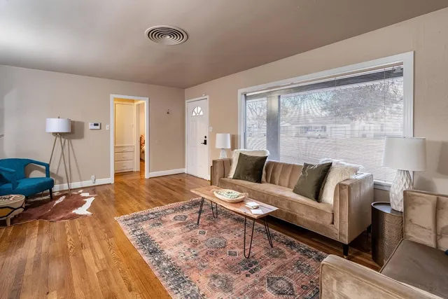 a living room with furniture and a large window