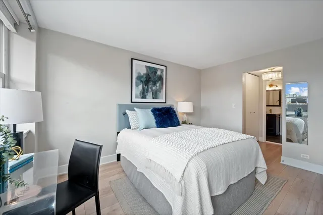 a bedroom with a bed and a chair