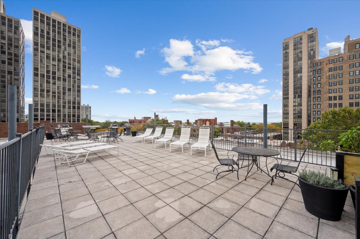 2300 North Commonwealth Avenue, Unit 7J Chicago, IL 60614 - Photo 19 of 20 a view of a terrace with chairs