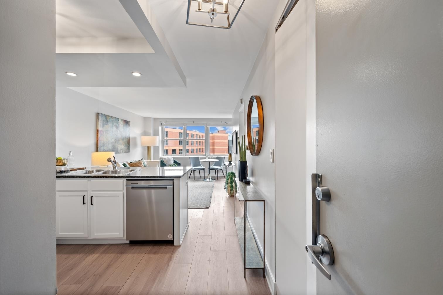 2300 North Commonwealth Avenue, Unit 7J Chicago, IL 60614 - Photo 3 of 20 a kitchen with stainless steel appliances granite countertop a refrigerator and a sink