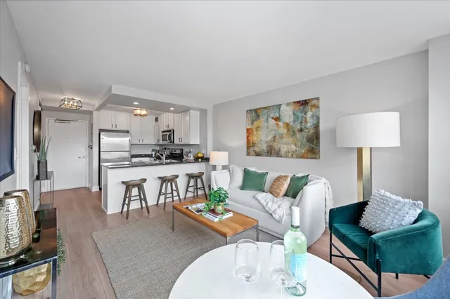 a living room with furniture and a table