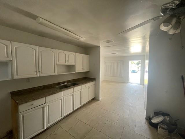 1104 West 24th Street Riviera Beach, FL 33404 - Photo 11 of 18 a kitchen with a sink and cabinets