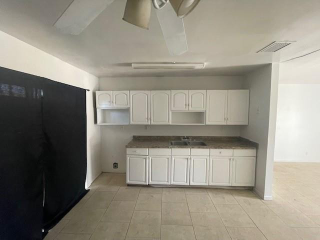 1104 West 24th Street Riviera Beach, FL 33404 - Photo 12 of 18 a kitchen with granite countertop a refrigerator and a sink