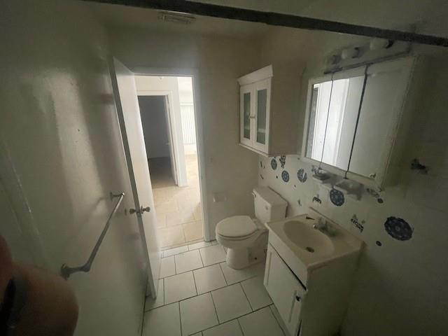 1104 West 24th Street Riviera Beach, FL 33404 - Photo 14 of 18 a bathroom with a granite countertop sink toilet and shower