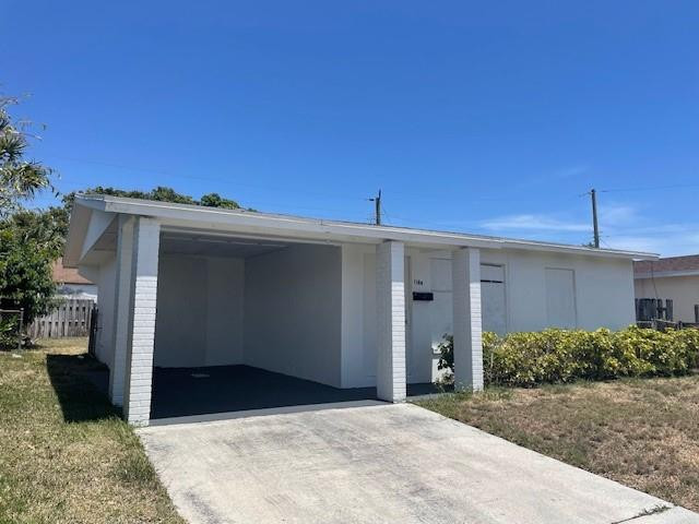 1104 West 24th Street Riviera Beach, FL 33404 - Photo 2 of 18 a view of a house with a garage