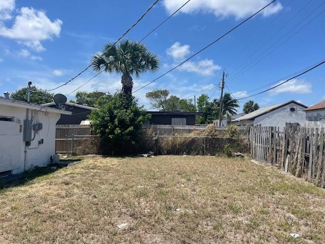 1104 West 24th Street Riviera Beach, FL 33404 - Photo 7 of 18 a view of a house with a yard